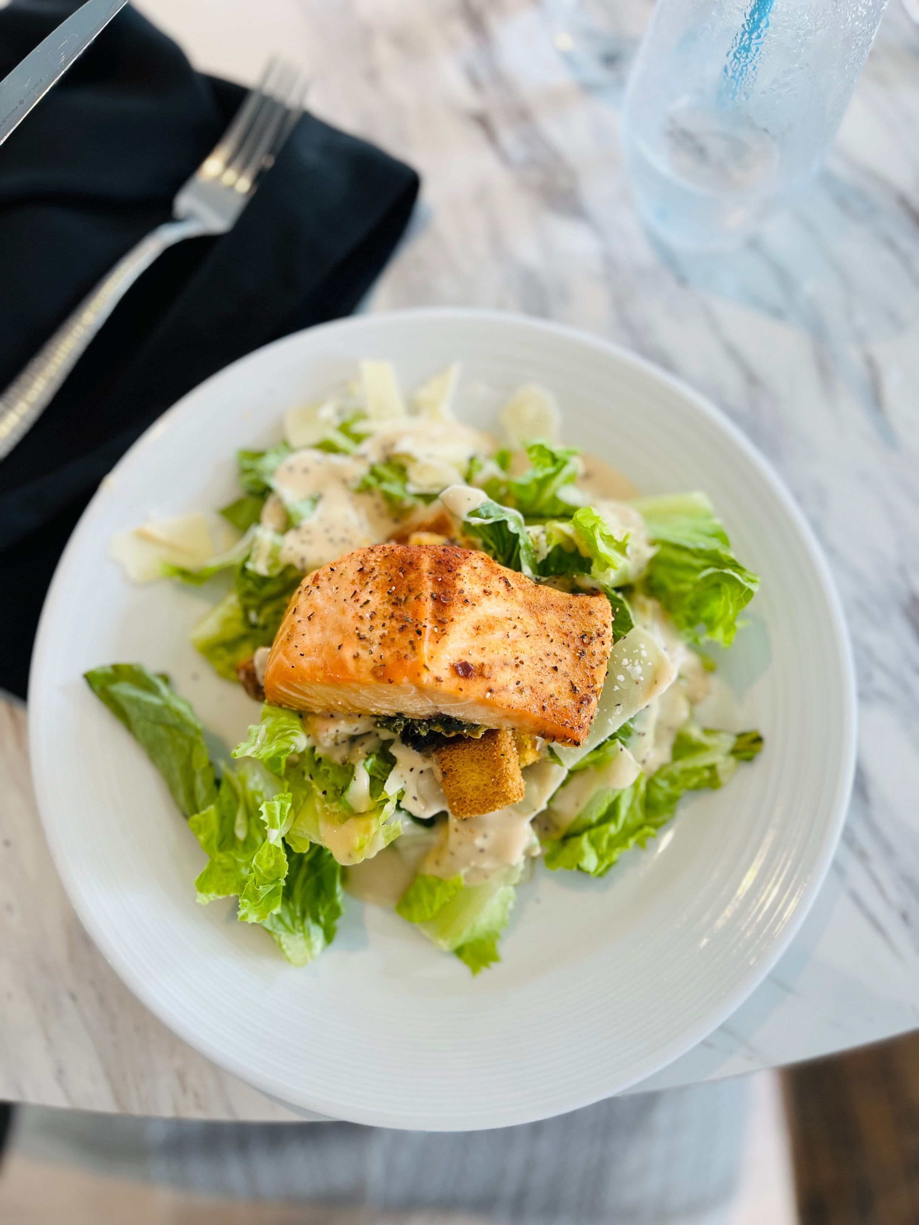 Fresh salmon atop well crafted cesar salad. Just one of the many options aboard the ships.